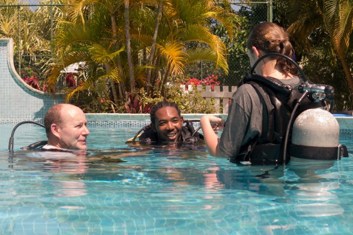 Dive instructor in pool with students